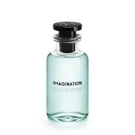 Light blue fragrance bottle with black stopper cap labeled Imagination on white background