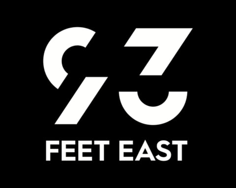 93 Feet East logo with stylised 93 design and text on black background